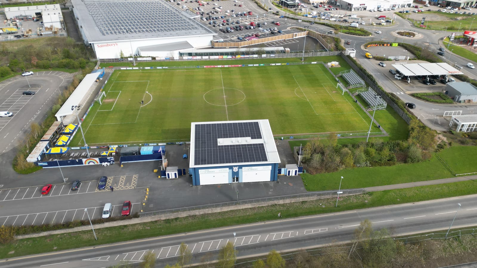 The grandstand and its rooftop array seen from above the pitch
