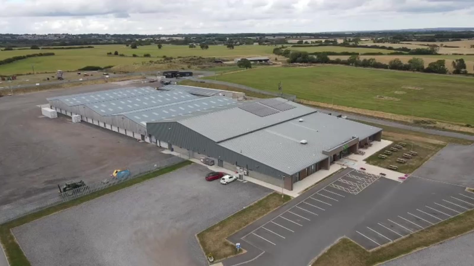 Aerial view of the Darlington Farmers Auction Mart buildings with solar panels on the roof