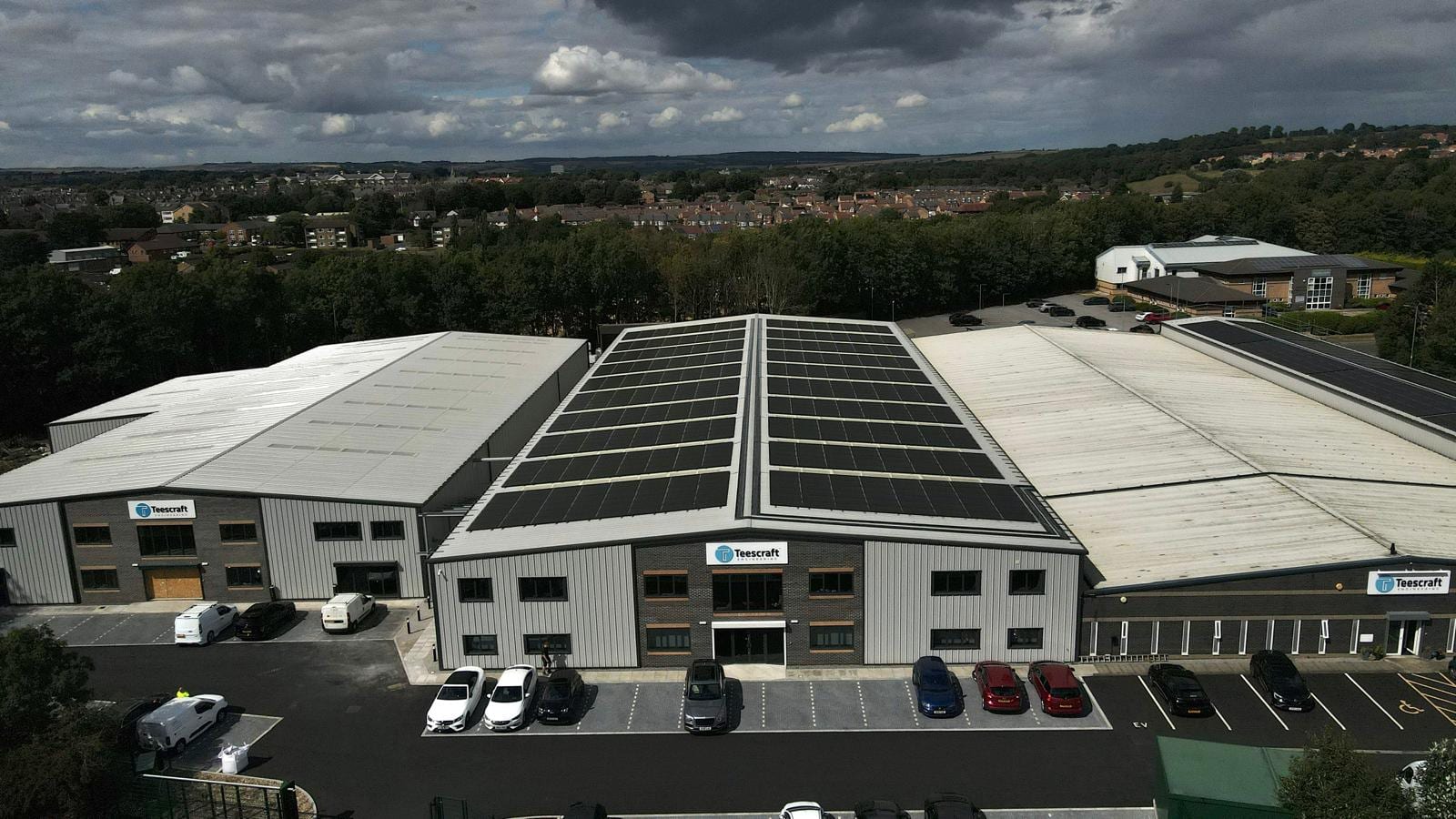 The Teescraft Engineering site from ground level, its solar-clad roof above the units