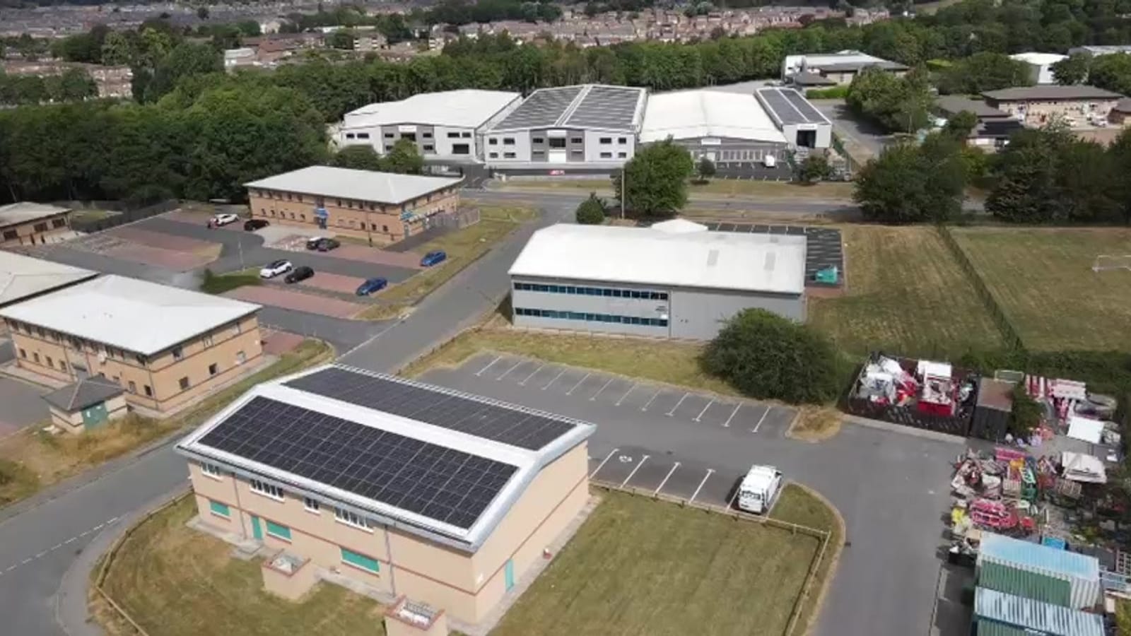Aerial view of the Vest Construction building with a solar array on its roof