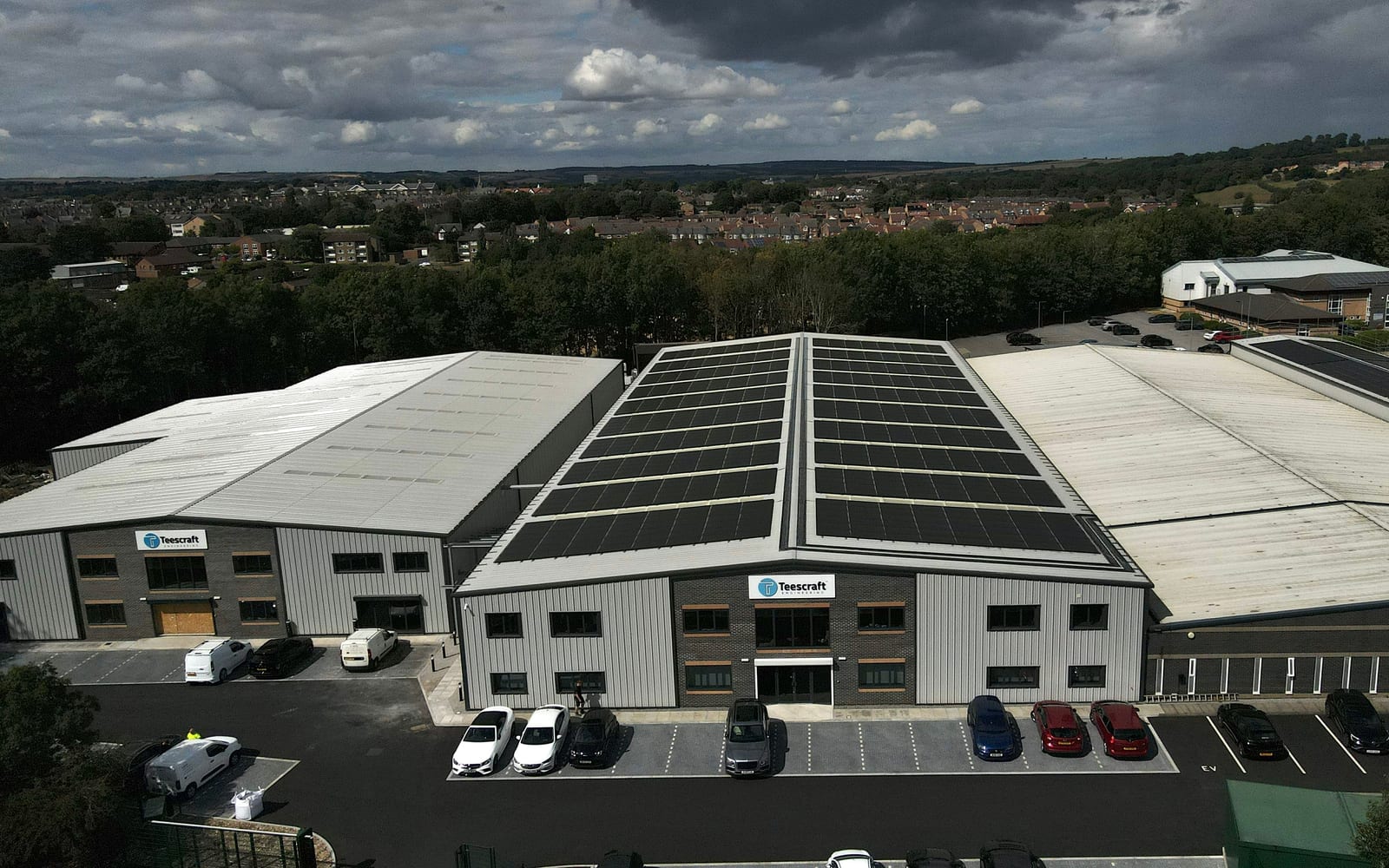 Aerial view of a completed commercial rooftop solar array