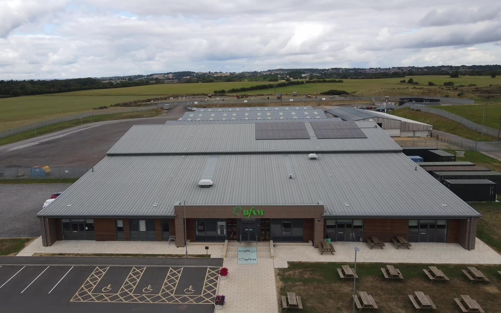 Aerial view of a completed commercial rooftop solar array