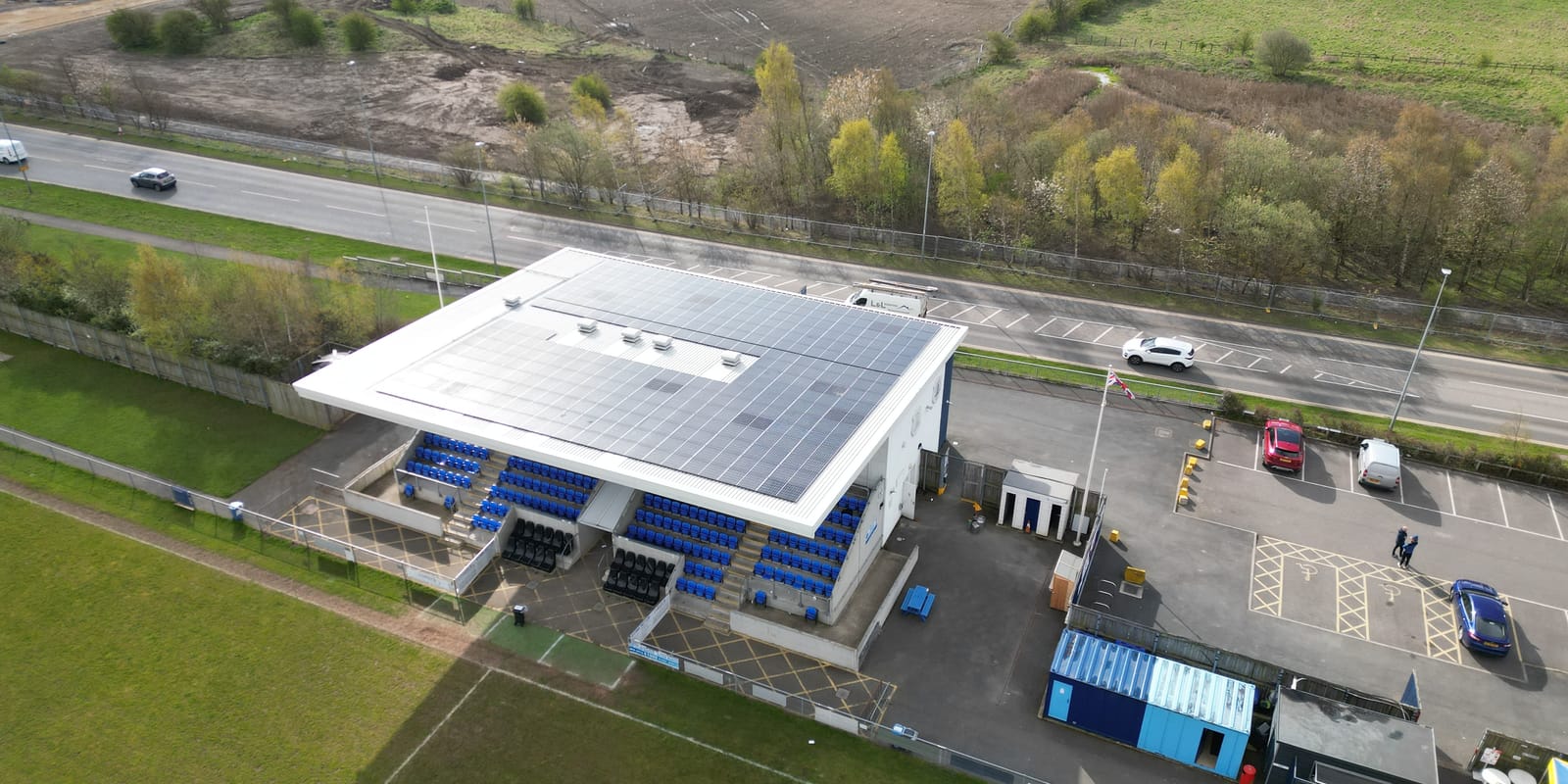 Aerial view of the Bishop Auckland Football Club grandstand with solar panels on its roof