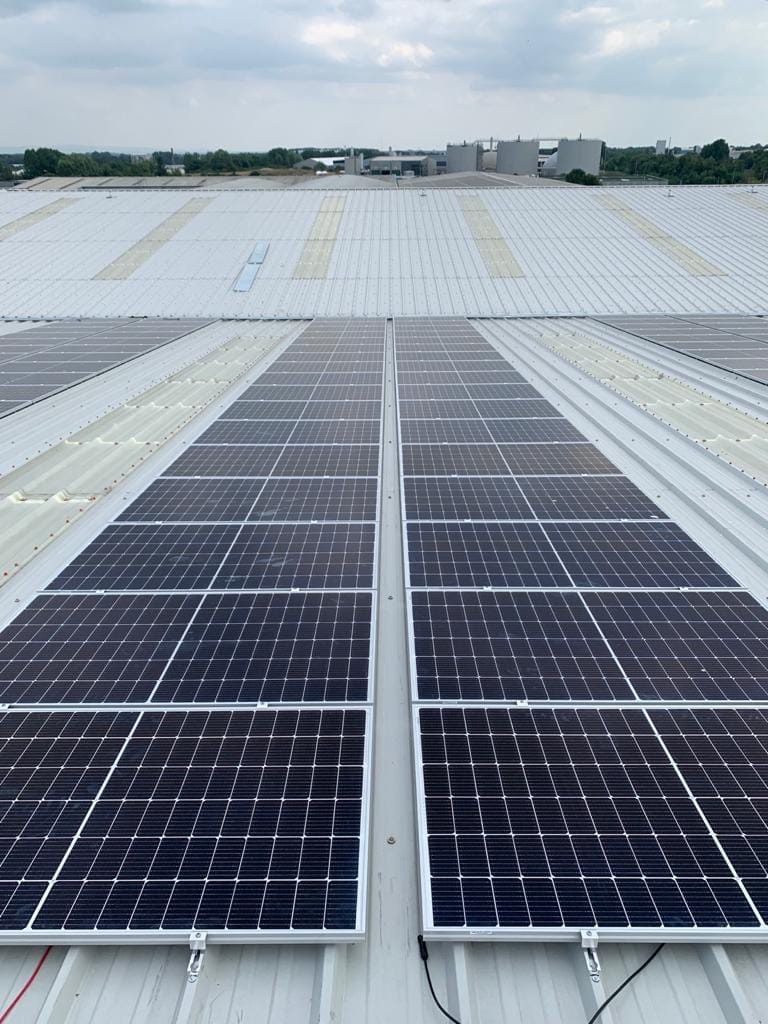 Close view of solar panels on a commercial roof