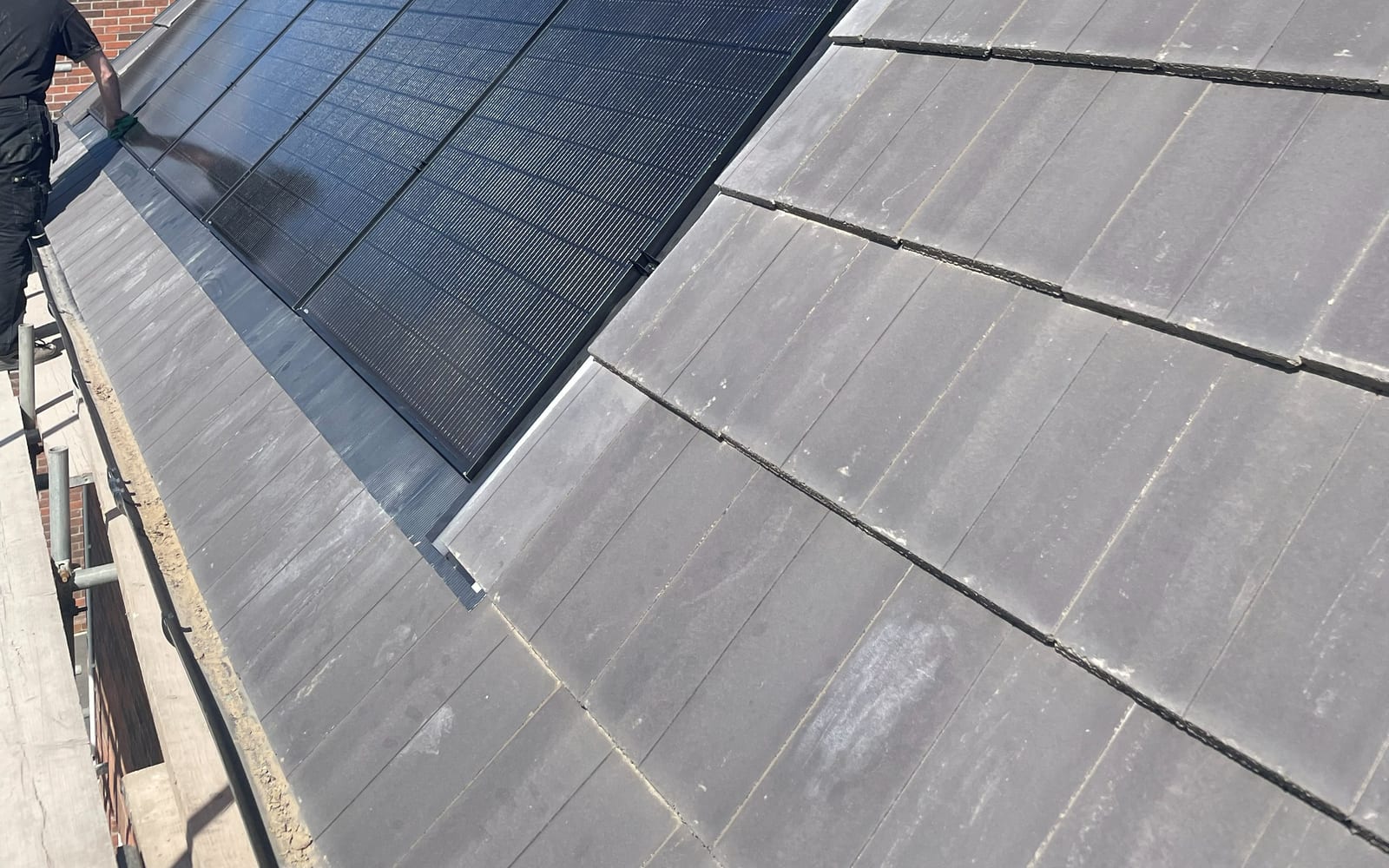 Solar panels installed on a pitched slate roof
